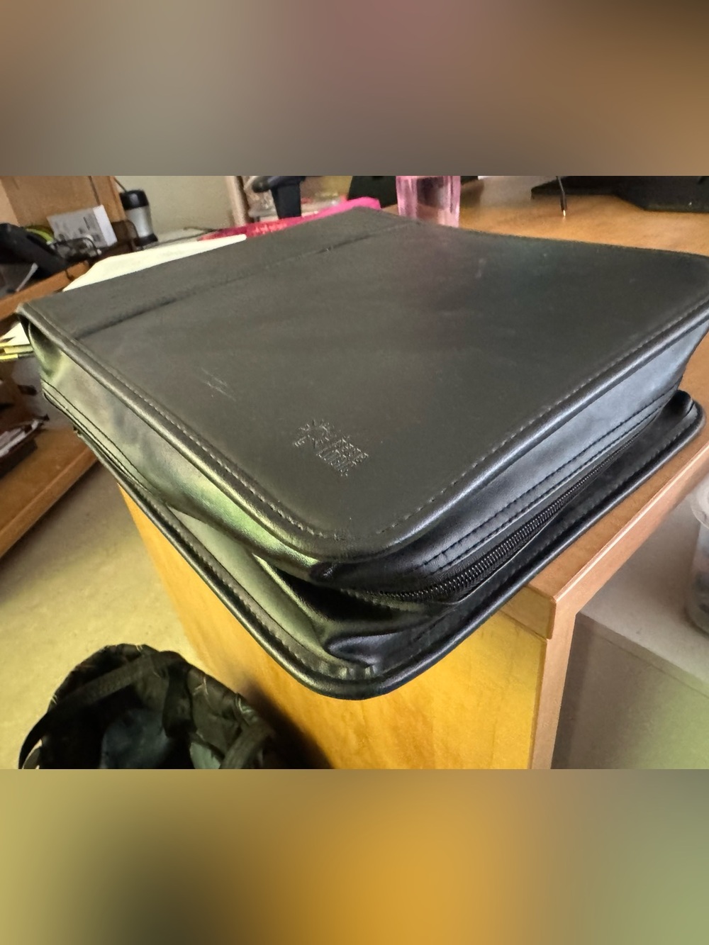 Black Leatherette Zippered case Logic full of DVDs